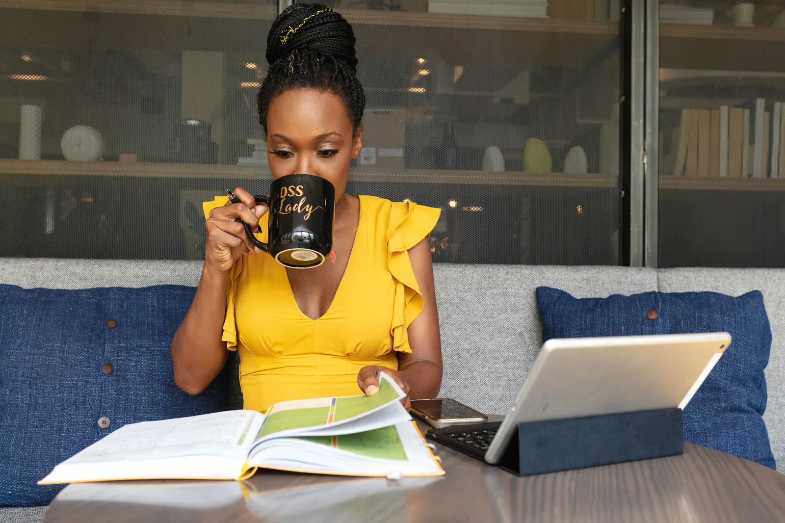 Lerae Funderburg reviewing materials while working.